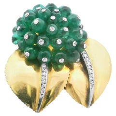 A corsage clip by Suzanne BELPERRON “Groseilliers” in platinum and yellow gold
