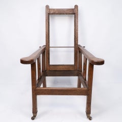 A Cotswold School Arts and Crafts reclining oak armchair of superior quality