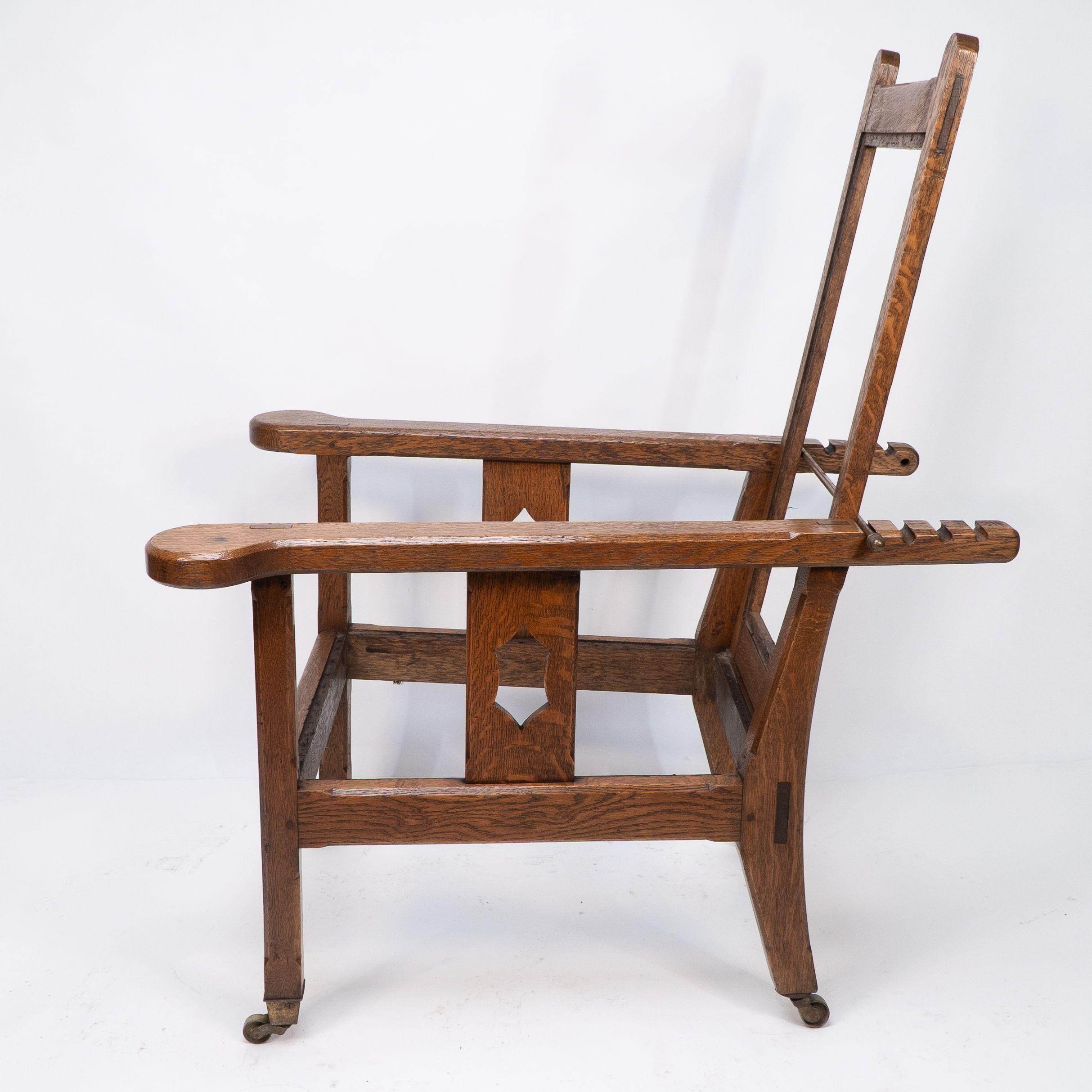 Late 19th Century A Cotswold School Arts and Crafts reclining oak armchair of superior quality For Sale