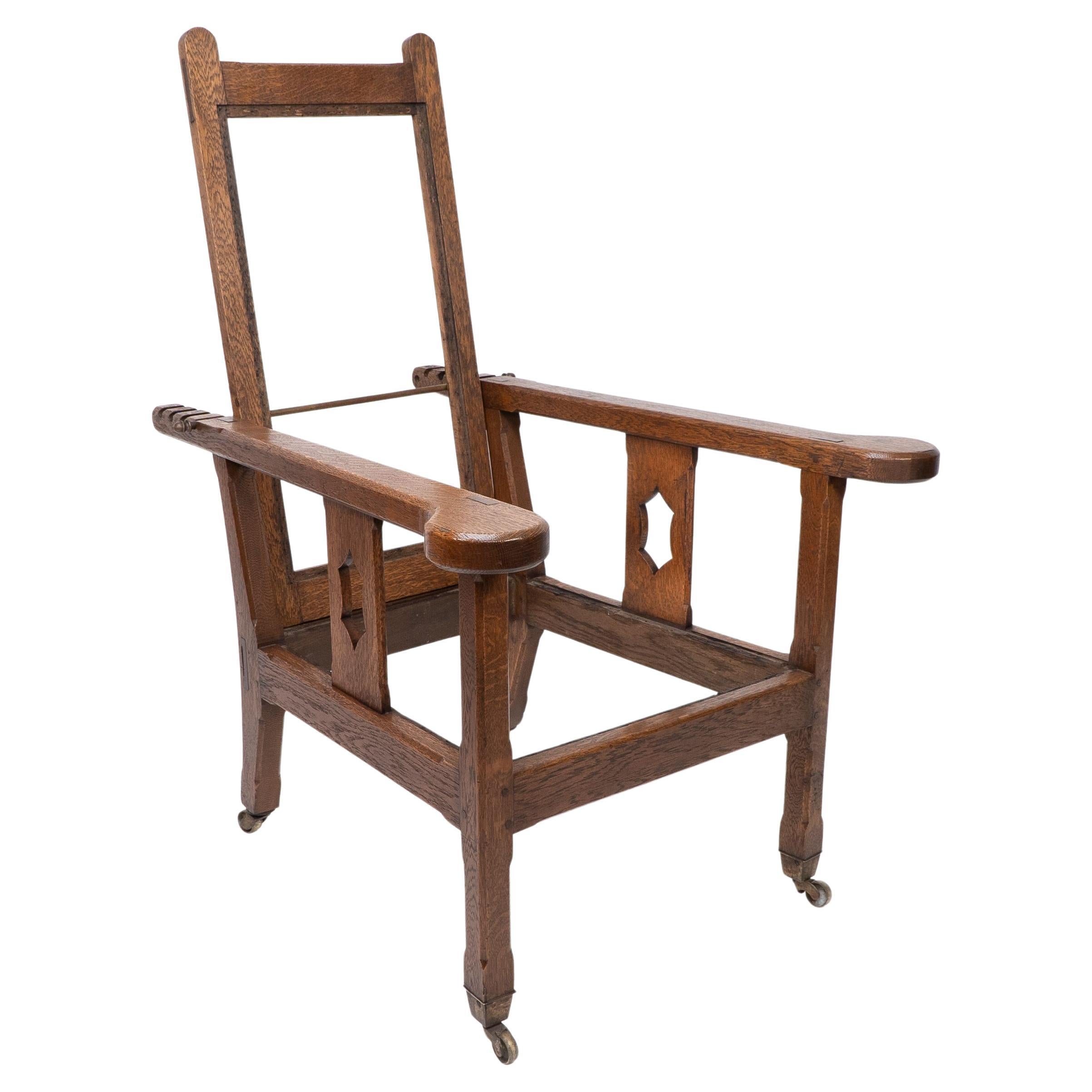 A Cotswold School Arts and Crafts reclining oak armchair of superior quality For Sale