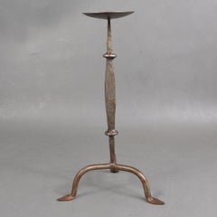 A Cotswold School Arts & Crafts hand wrought iron pricket candlestick
