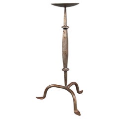 A Cotswold School Arts & Crafts hand wrought iron pricket candlestick