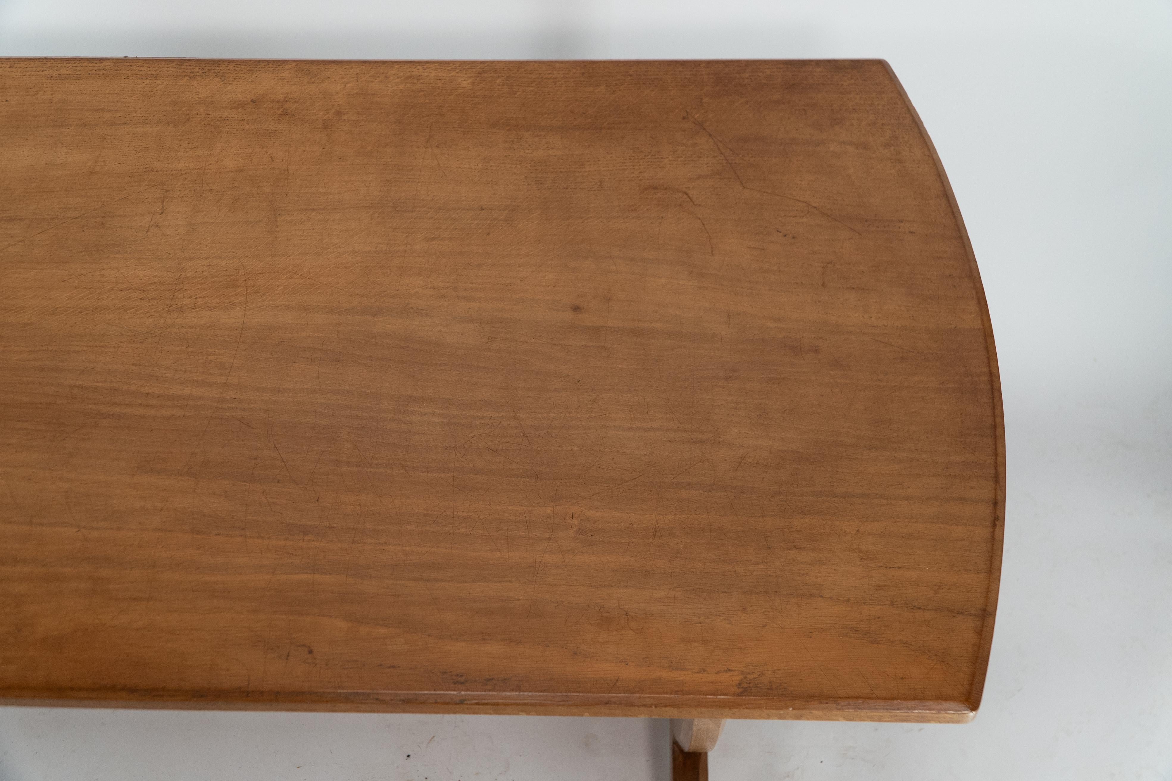 Oak A Cotswold School Arts & Crafts oak coffee table with U shaped base.