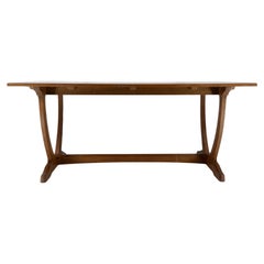 A Cotswold School Arts & Crafts oak coffee table with U shaped base.