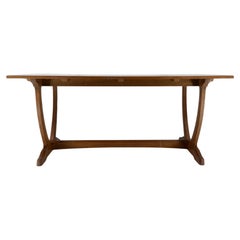 A Cotswold School Arts & Crafts oak coffee table with U shaped base.