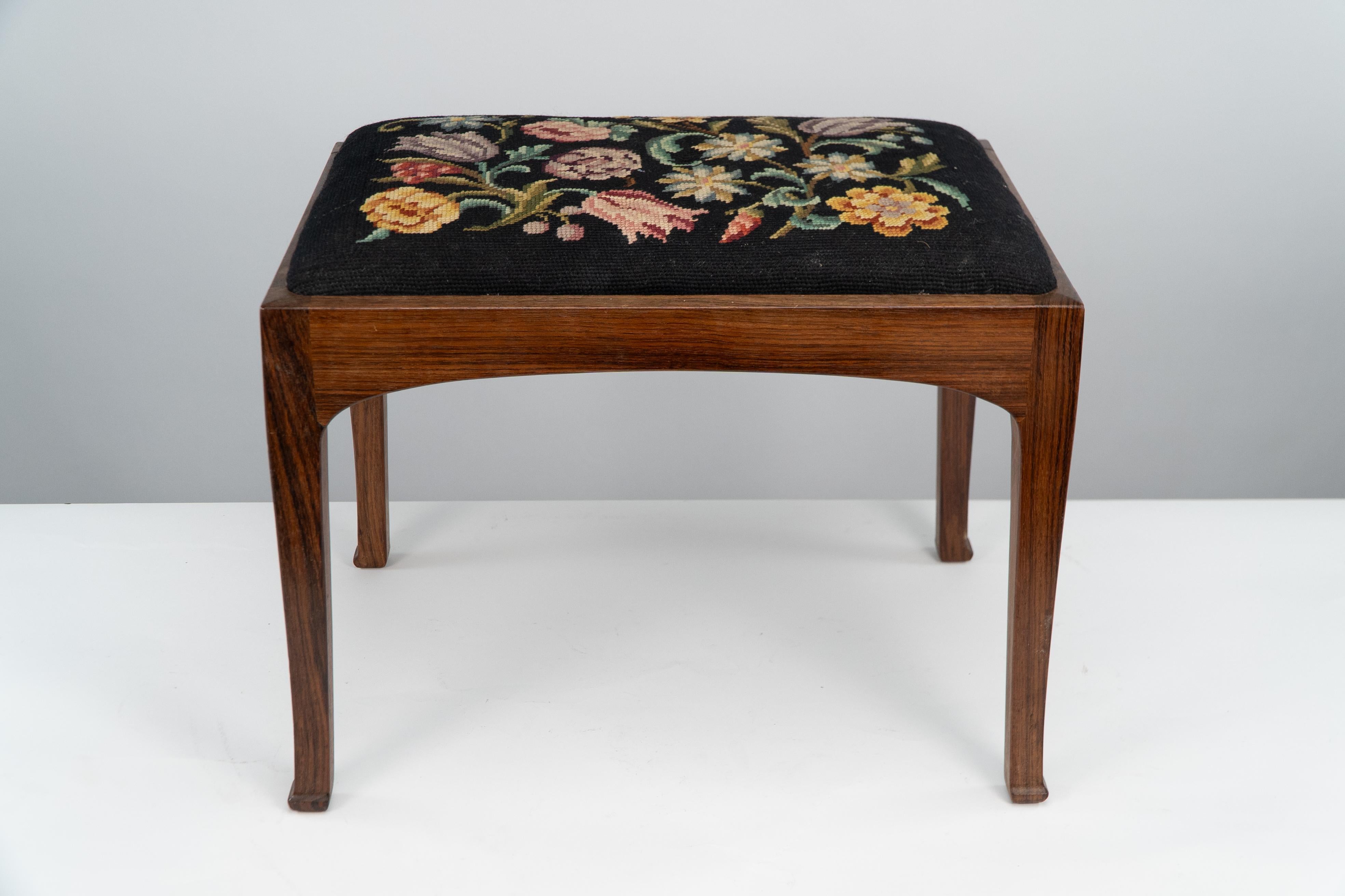 Early 20th Century Edward Barnsley. A Cotswold School walnut stool with the original tapestry seat. For Sale