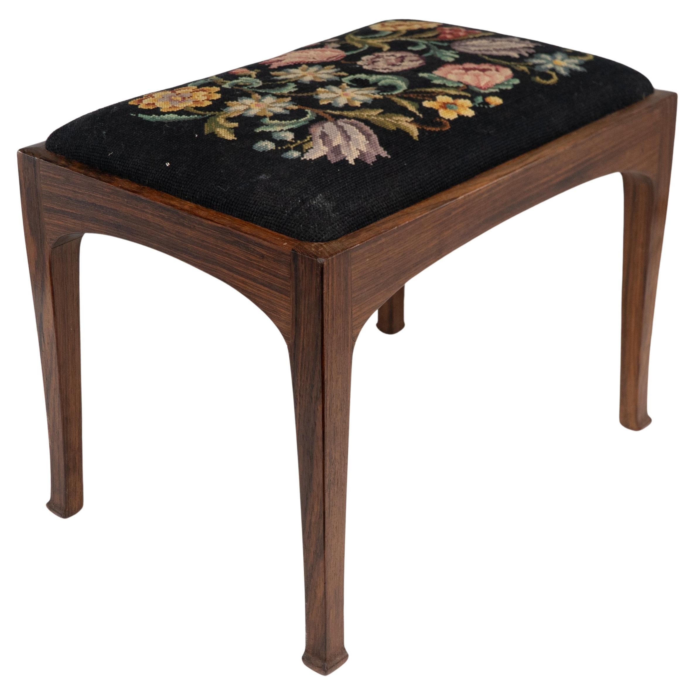 Edward Barnsley. A Cotswold School walnut stool with the original tapestry seat.