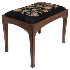 Antique Edward Barnsley. A Cotswold School walnut stool with the original tapestry seat.