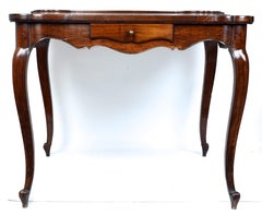 A Country French Louis XV Period Walnut Game Table Mid-18th c