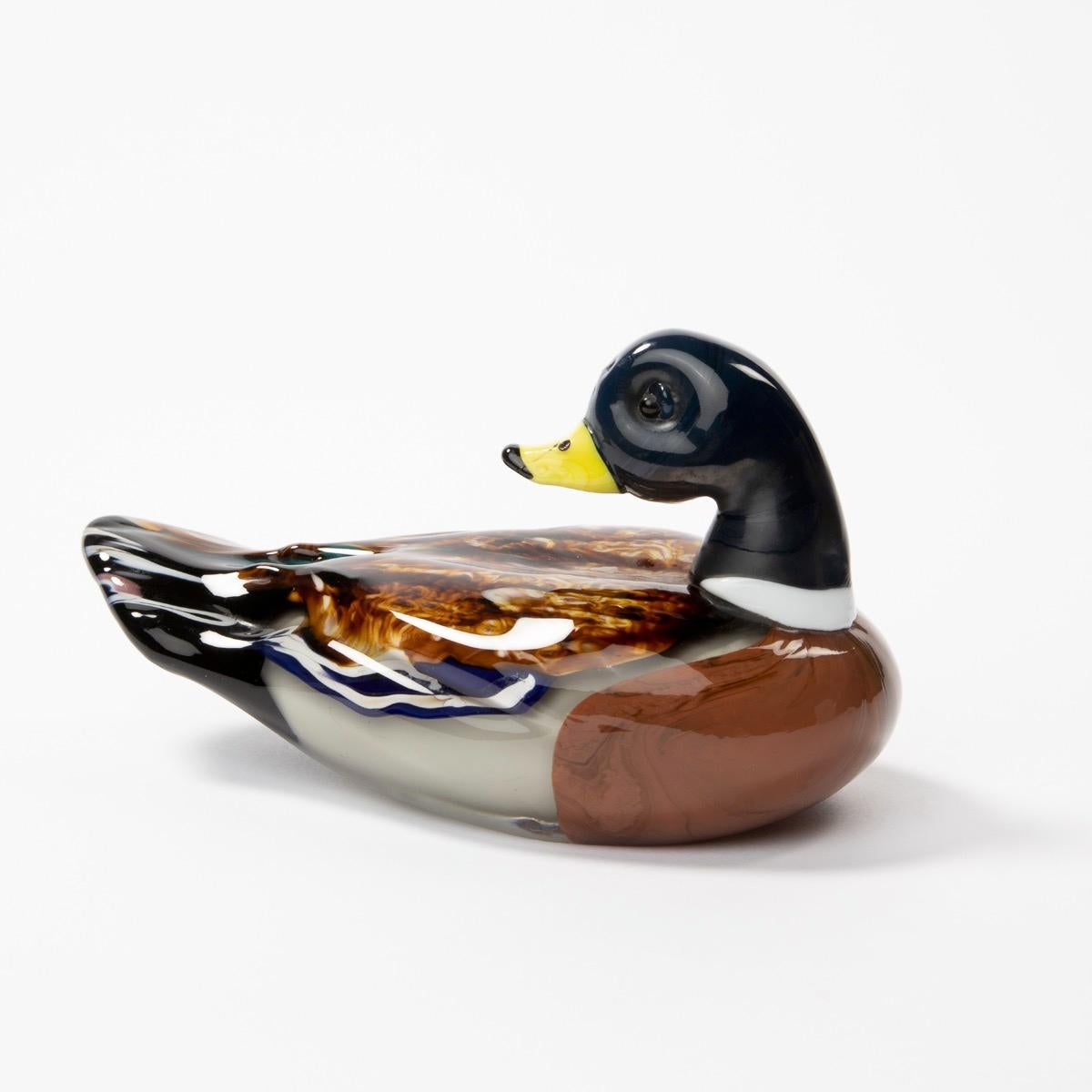Sculptures by Toni Zuccheri represents a couple of ducks in polychrome glass with a subtle blend of colors for deep details.

We are located in Belgium, we present Postwar decorative arts with an emphasis on line Vautrin, French decorators (Adnet,