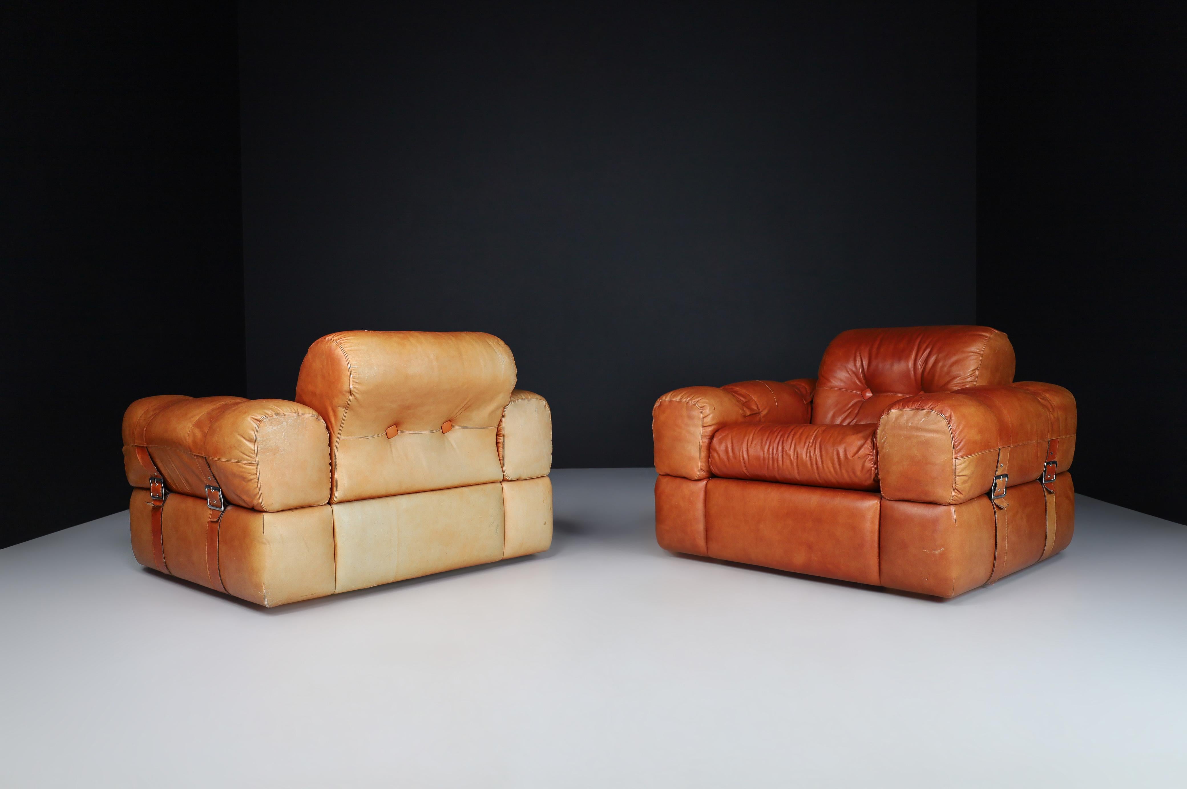 A couple of Lounge Chairs in Patinated Cognac Leather, Italy 1970   1