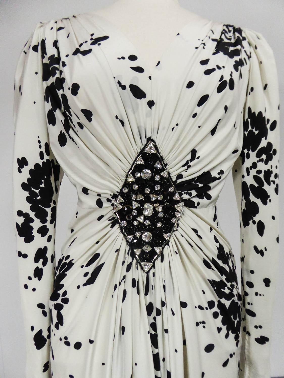 On hold for a french exhibition until November 2024, available after this date
Circa 1984
France

Haute Couture evening dress attributed to Yves Saint Laurent from the 80s. Printed silk crepe (Maison Abraham?) of splash of black paint on a