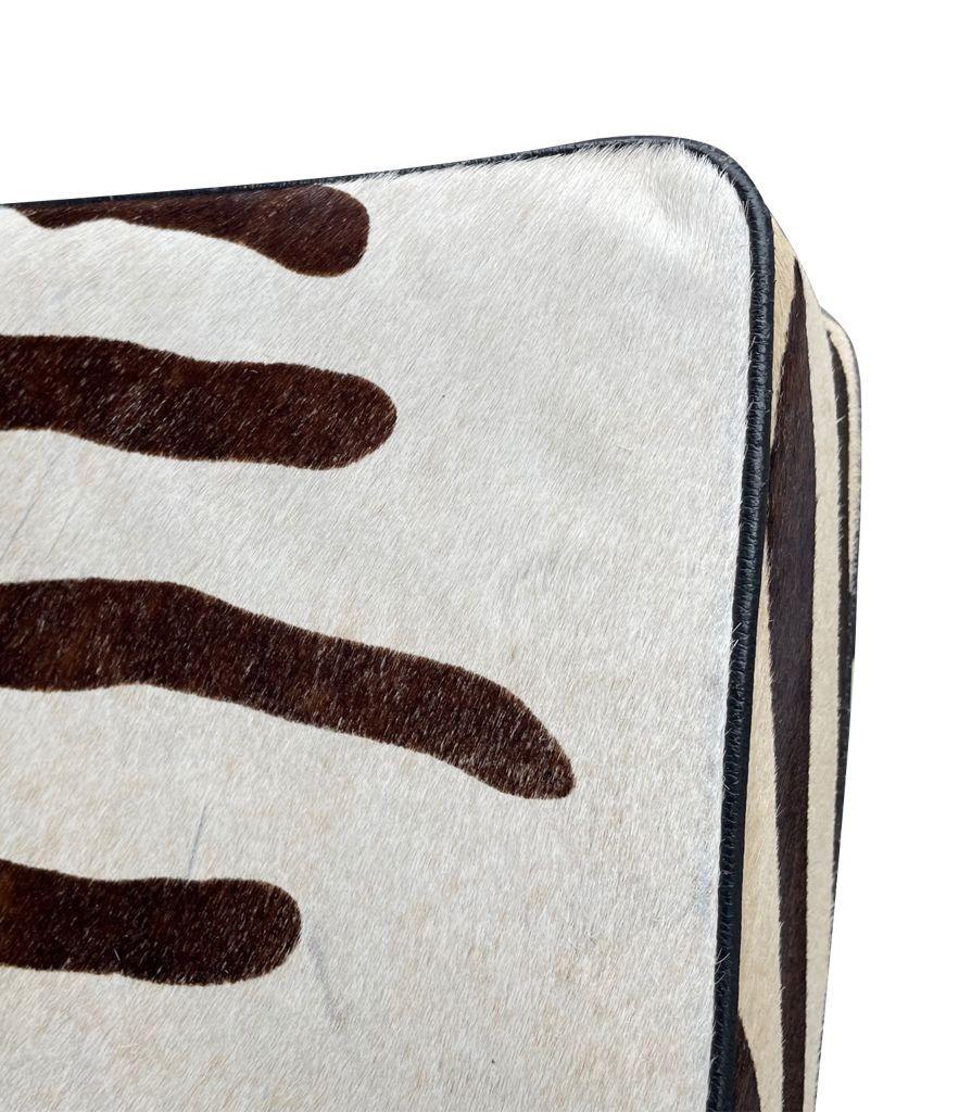 Cowhide Covered Ottoman with Printed Zebra Skin Design 1