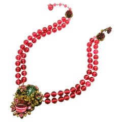 A cranberry glass and coloured paste double row necklace, Miriam Haskell, 1950s