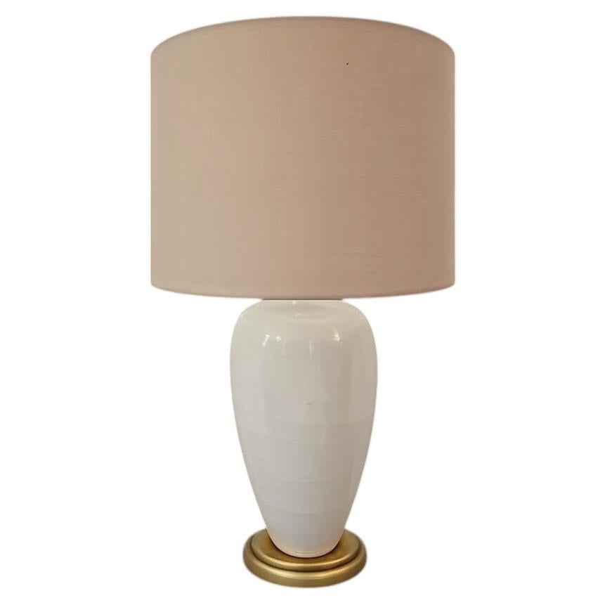 A Cream Color Ceramic Lamp on Giltwood Base with Linen Shade