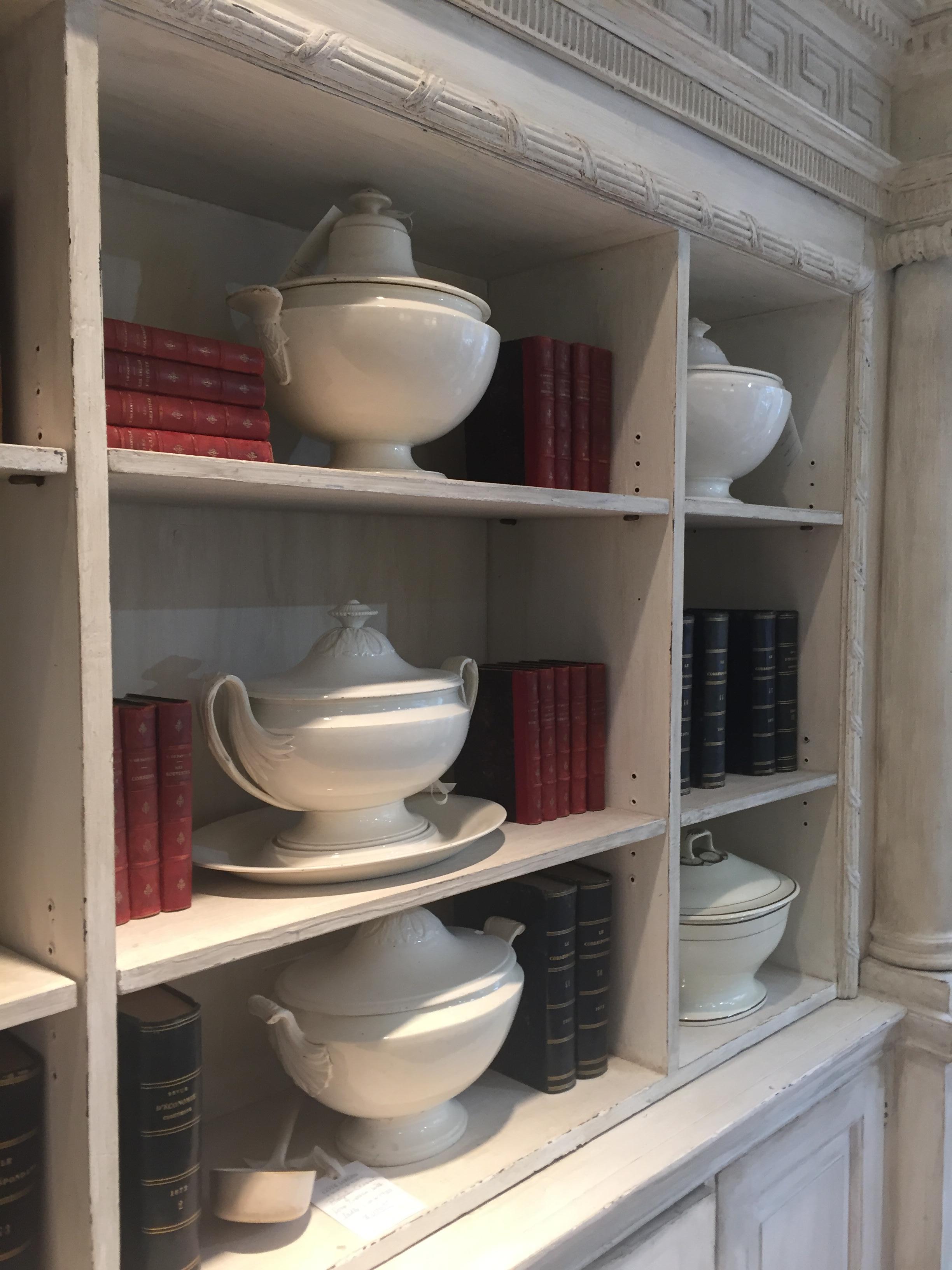 A cream painted wooden neoclassical bookcase in two sections 3