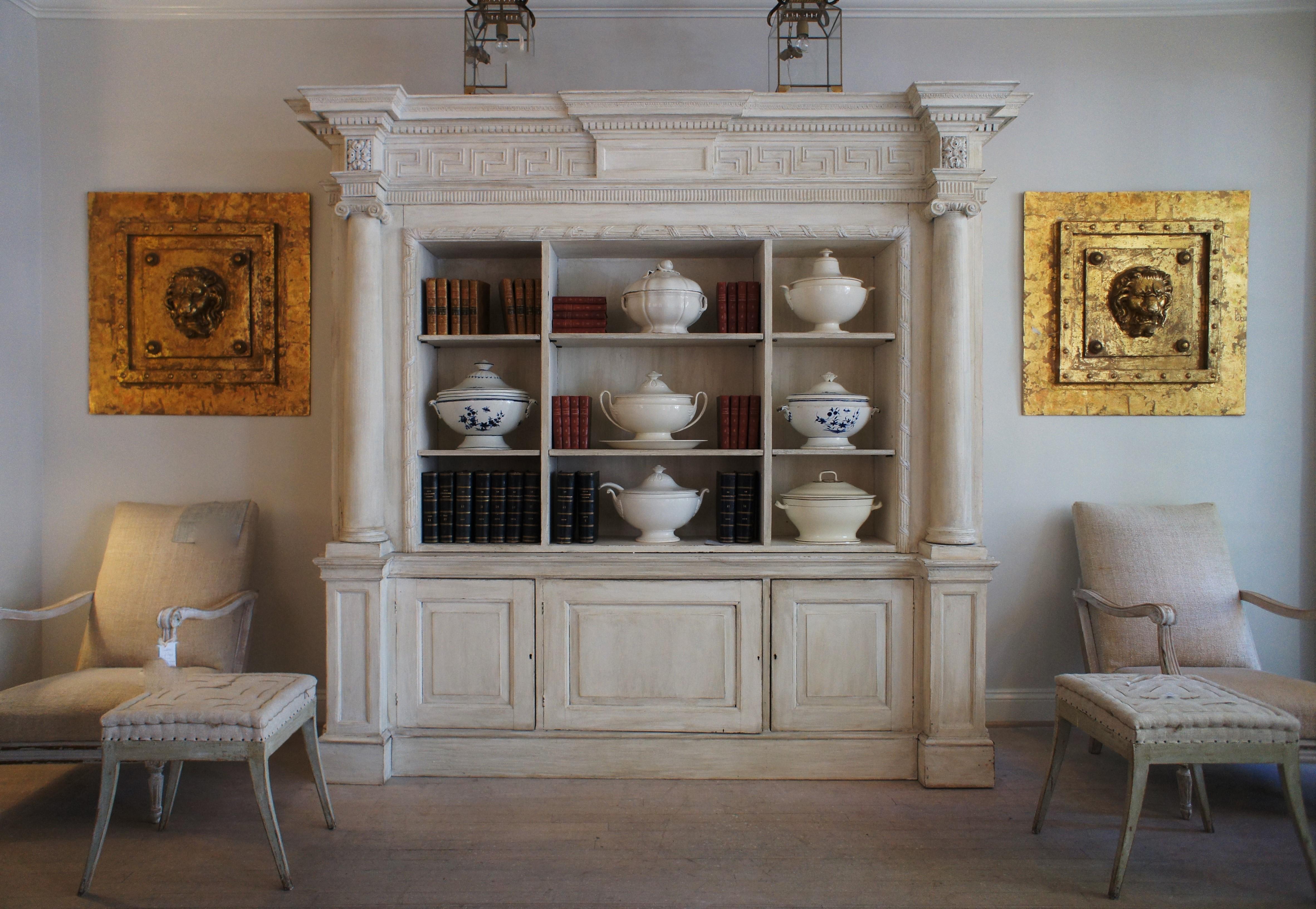 A cream painted wooden neoclassical bookcase in two sections 5
