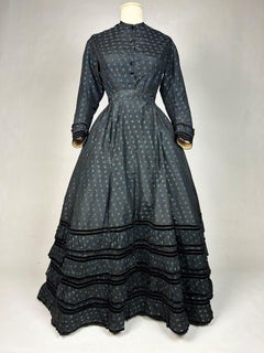 A Crinoline Day dress in black taffeta brocaded silk brocaded France Circa 1870