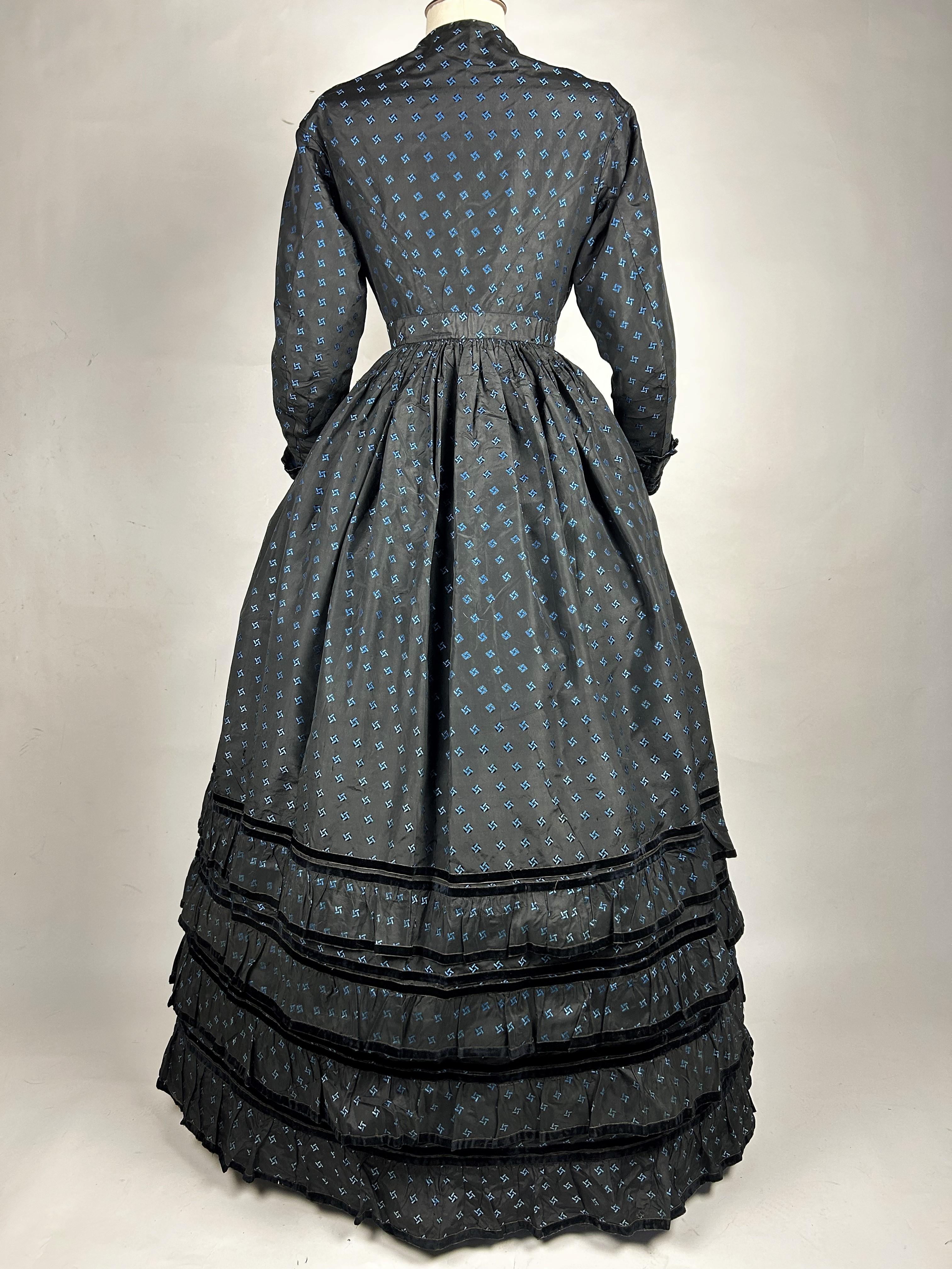 Black A Crinoline Day dress in black taffeta brocaded silk brocaded France Circa 1870