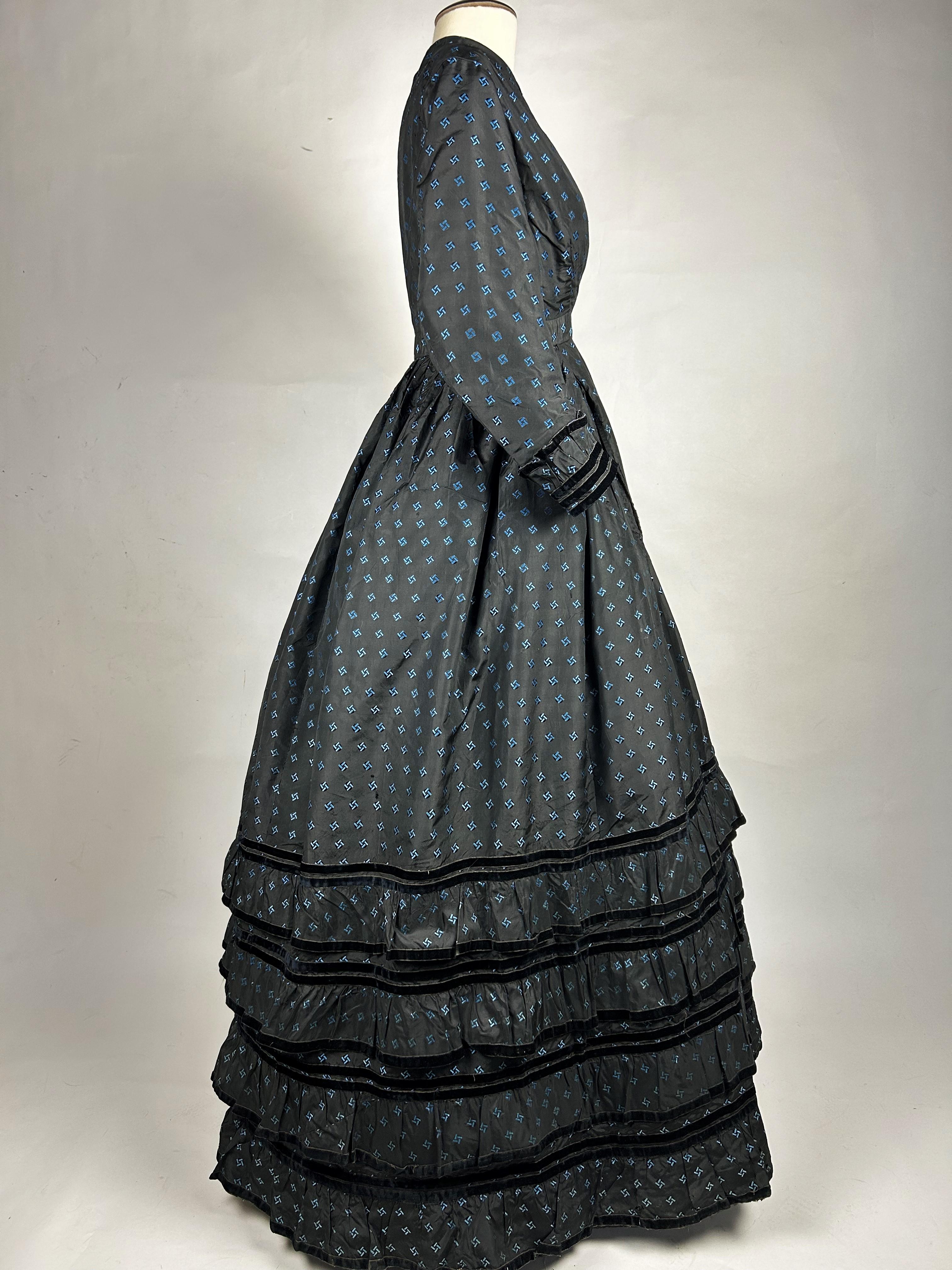 Women's A Crinoline Day dress in black taffeta brocaded silk brocaded France Circa 1870