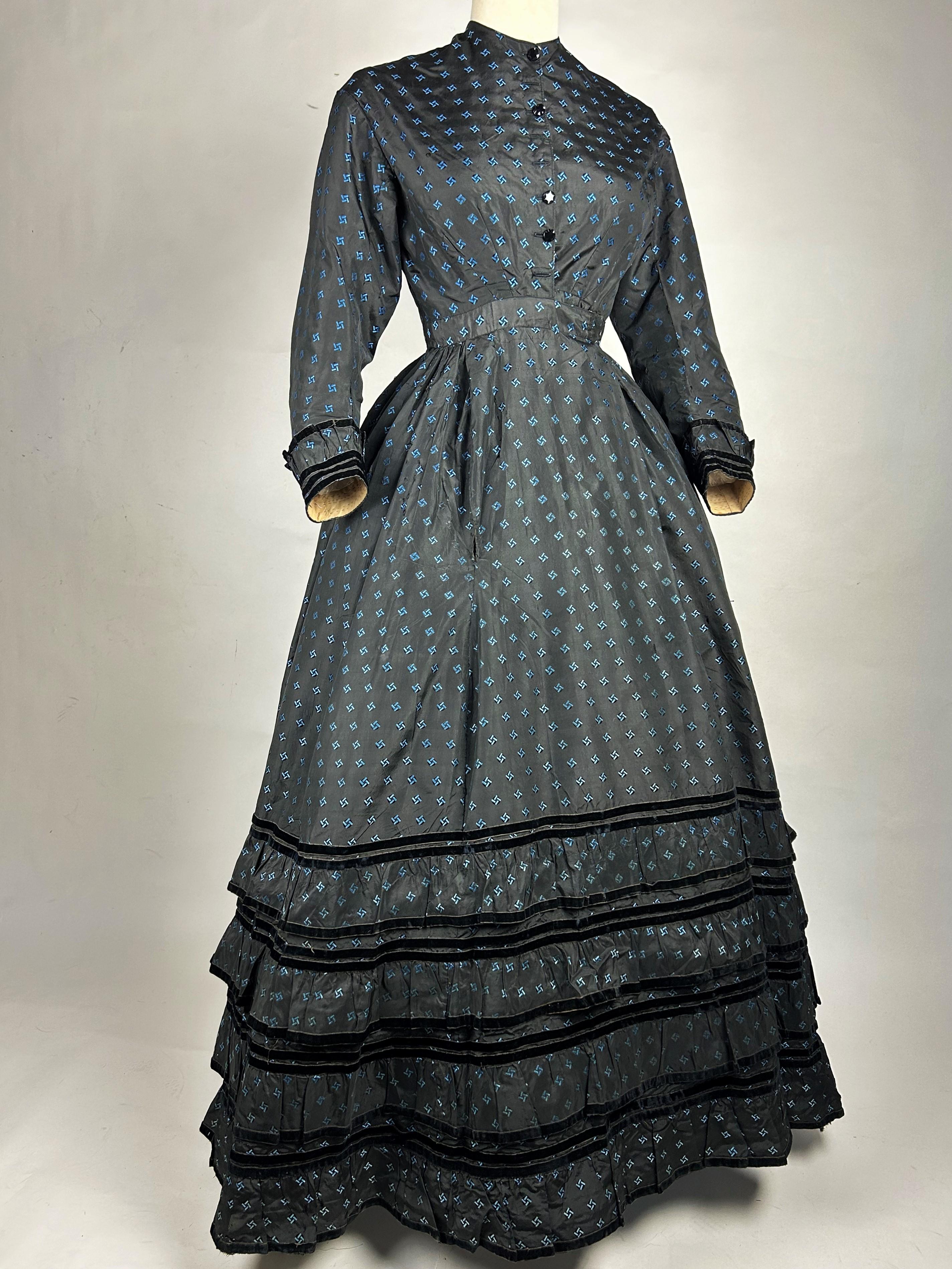 A Crinoline Day dress in black taffeta brocaded silk brocaded France Circa 1870 1