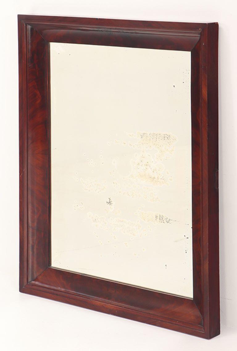 A crotch mahogany Empire wall mirror circa 1830. In Good Condition For Sale In Philadelphia, PA