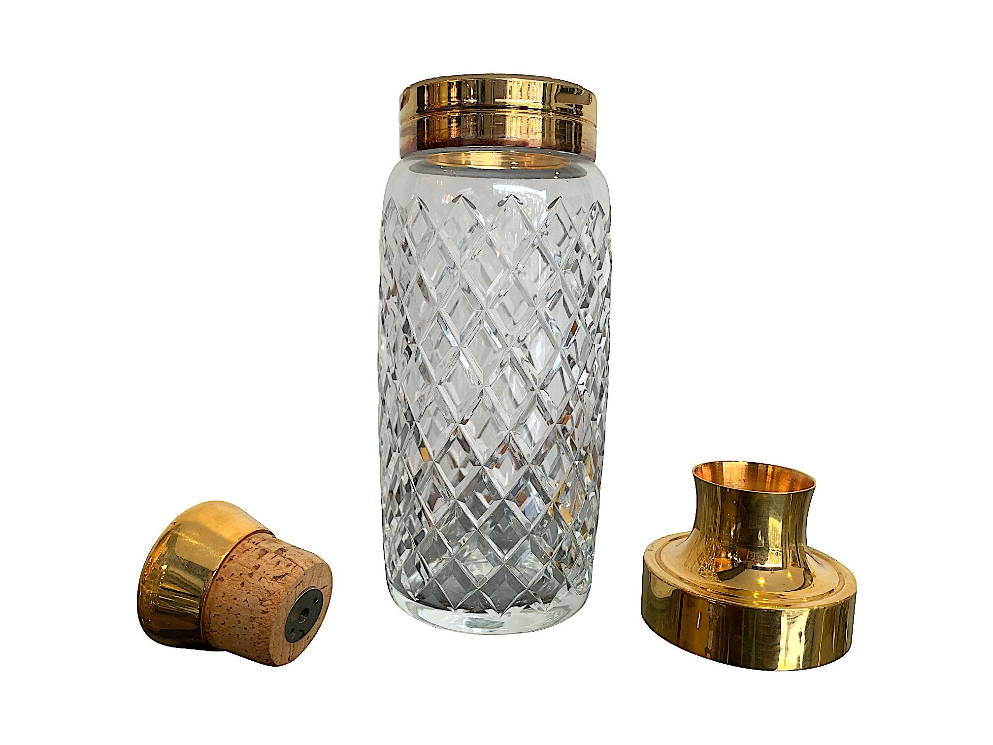 A 1950s crystal and gilt cocktail set with cocktail Shaker with removable top and lid with cork stopper. With six matching crystal gilt edged tumblers decorated with Greek key design. A lovely gift set for any cocktail lover.