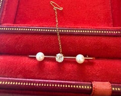 A Cultured Pearl and Diamond Bar Brooch