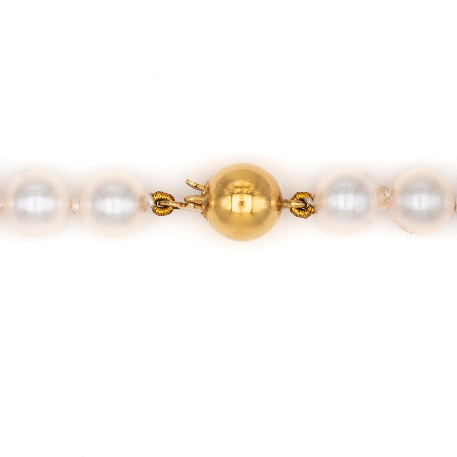 A cultured pearl necklace, the single row consisted of fifty-nine saltwater cultured pearls, with diameter 5.5-6mm, to an 18ct gold ball clasp of 6mm diameter, total length 41cm, gross weight 18.2 grams.

This lovely pearl necklace comes from the
