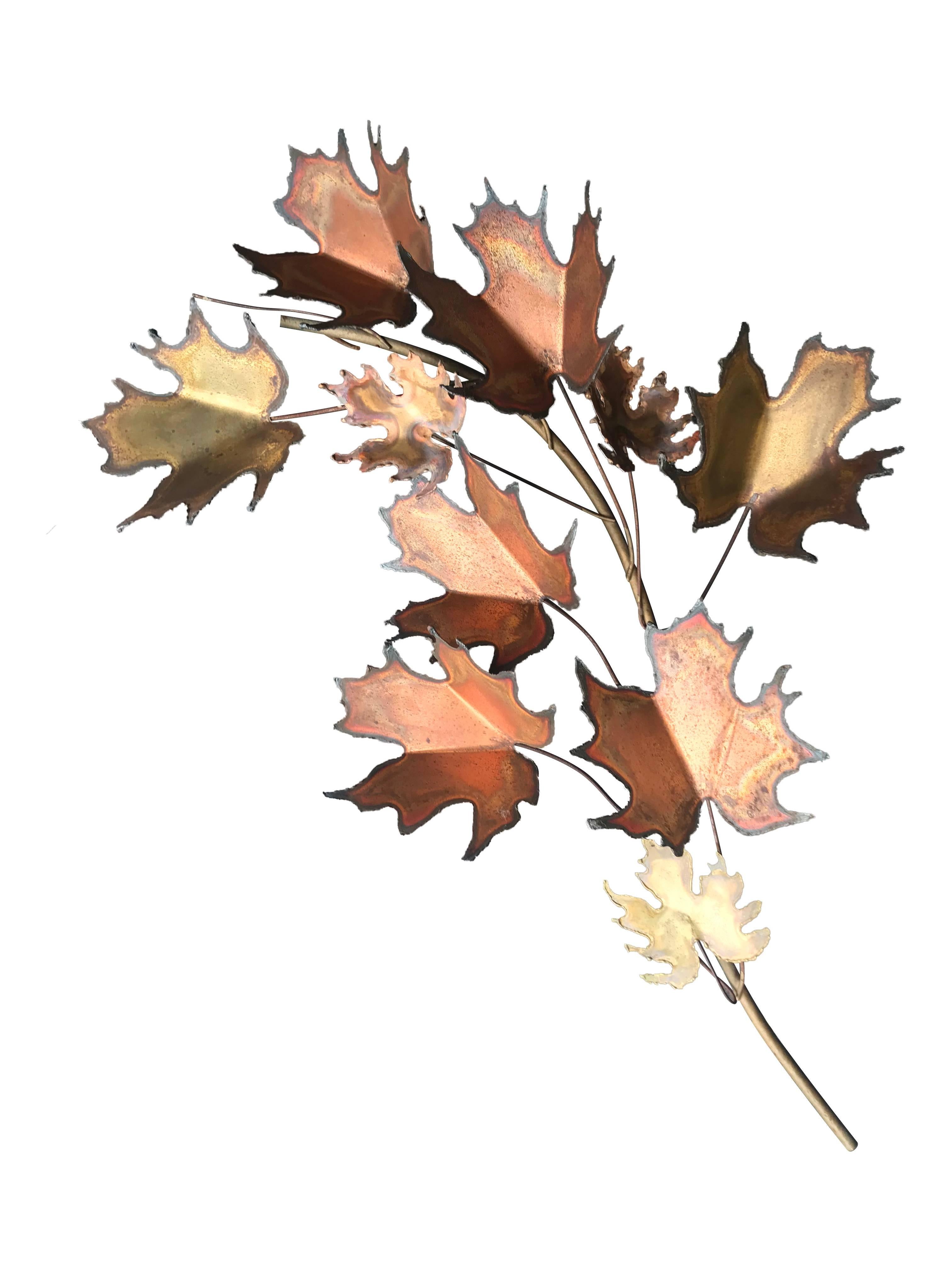 A Curtis Jere maple leaf wall sculpture with torch cut brass and copper maple leaves. Signed 