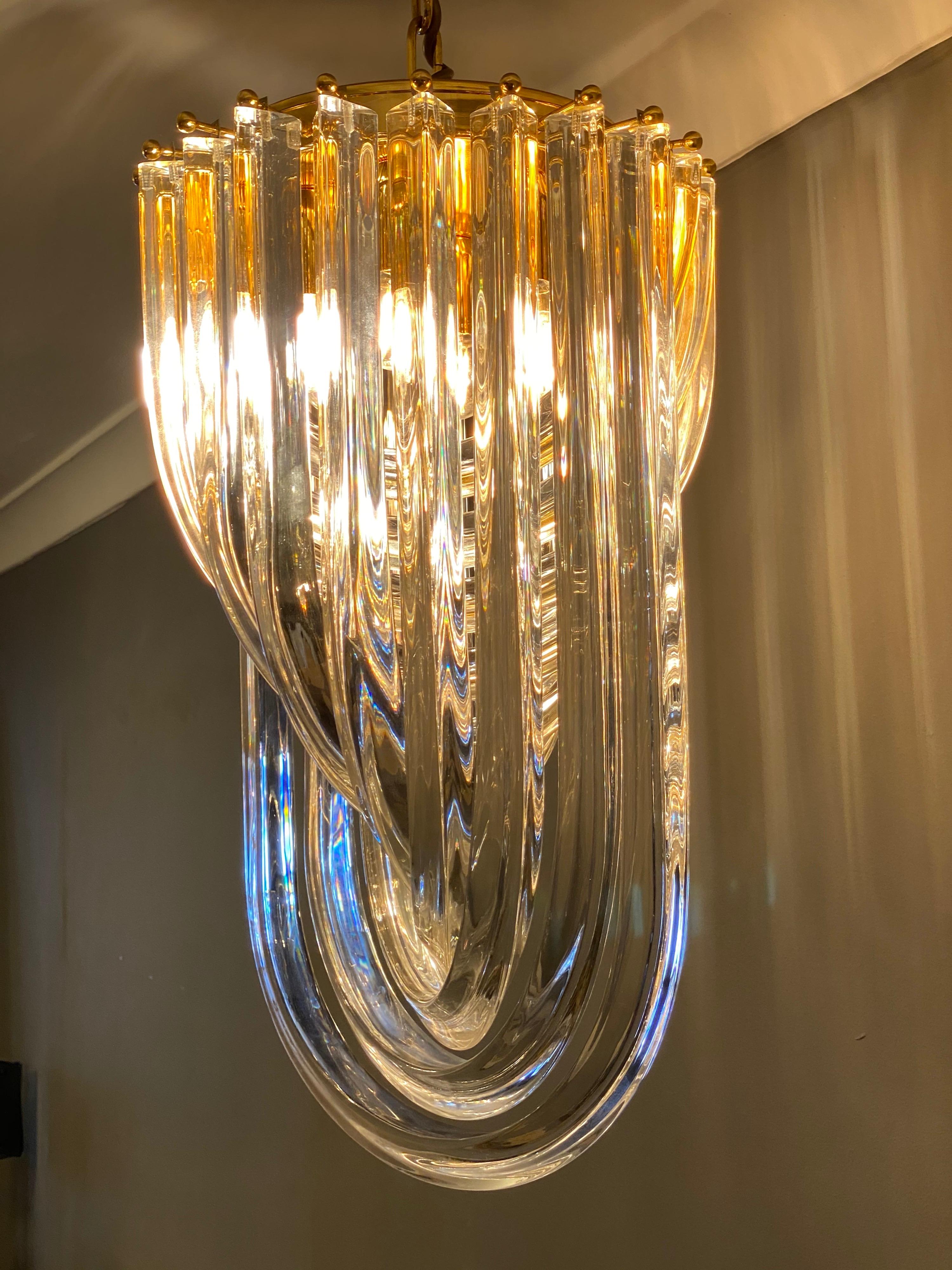 A Murano curved glass chandelier with brass frame, by Industria Veneziana designed by Carlo Nason in the 1970s. This is a late 1980s model in good order and fantastic quality, by a recognised Italian manufacturer in Venice.