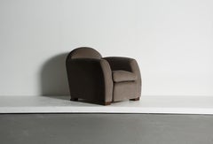 A Curved Arm Salon Club Chair, Upholstered in Pure Taupe Alpaca