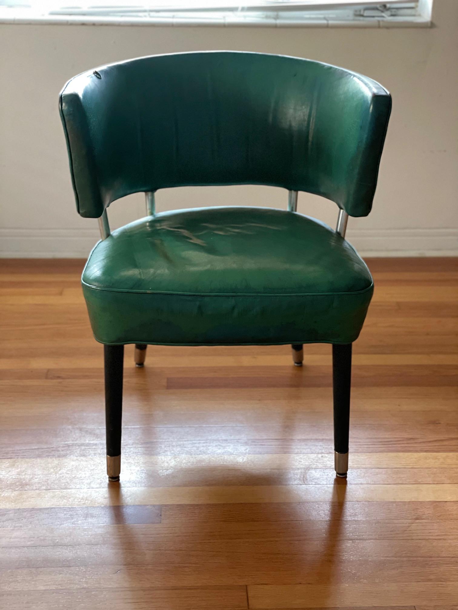 A rare curved back occasional chair from the famed ocean liner SS United States. Retaining original patent blue leather, aluminum legs covered in leather. Beautiful patina (note leather has a few tears) and historical rarity. 
