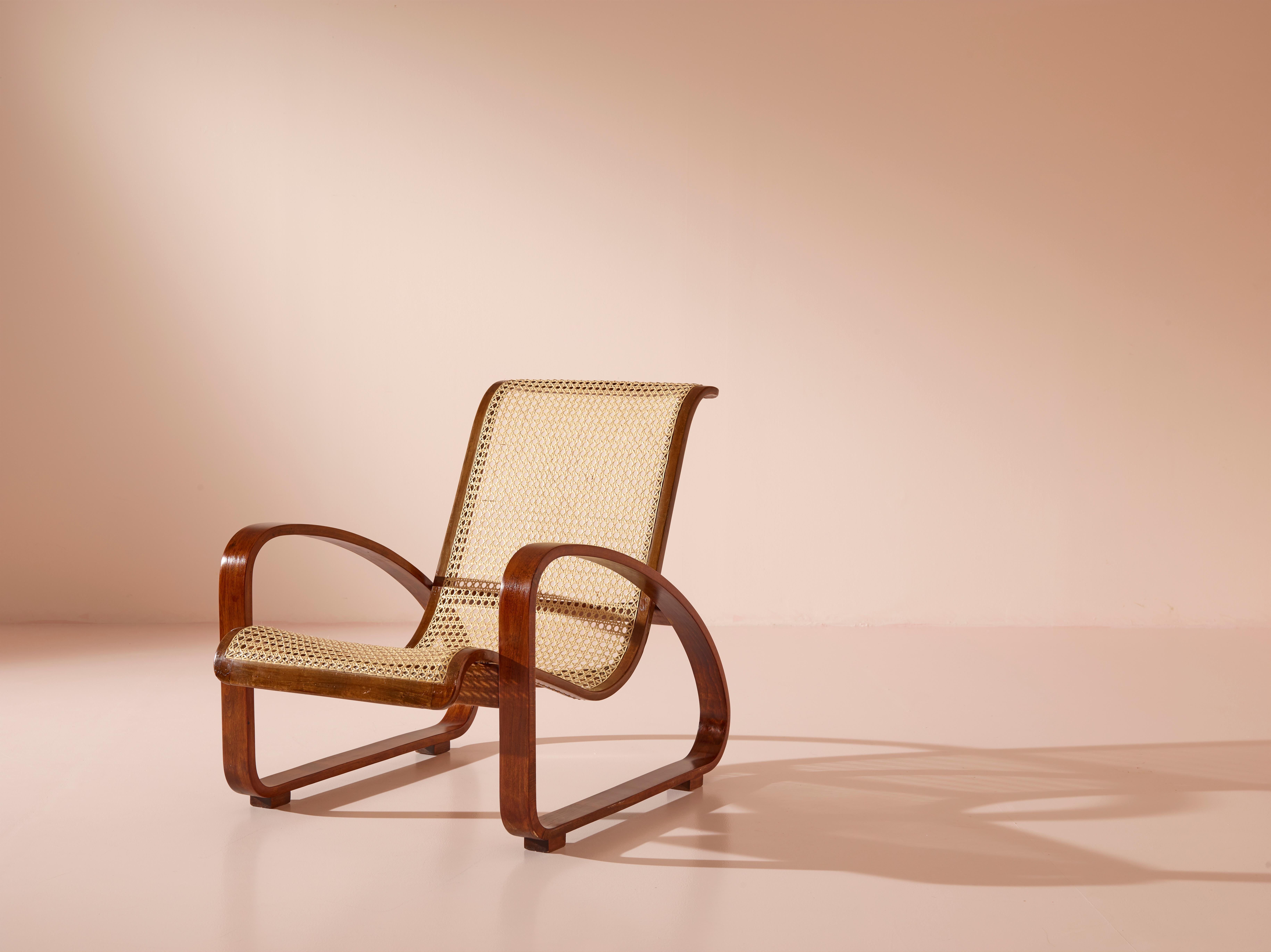 A rare armchair from the 1930s manufactured by Ditta Porino in Torino, Italy. Crafted during the interwar period, its clean and simple lines are a testament to the designer's ingenuity, featuring a stunning combination of curved beechwood for the