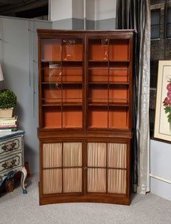 A Curved French Walnut Bibliothèque (One of Two)