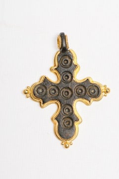 A Curvy Byzantine Bronze Cross w/ elaborate Gold Trim