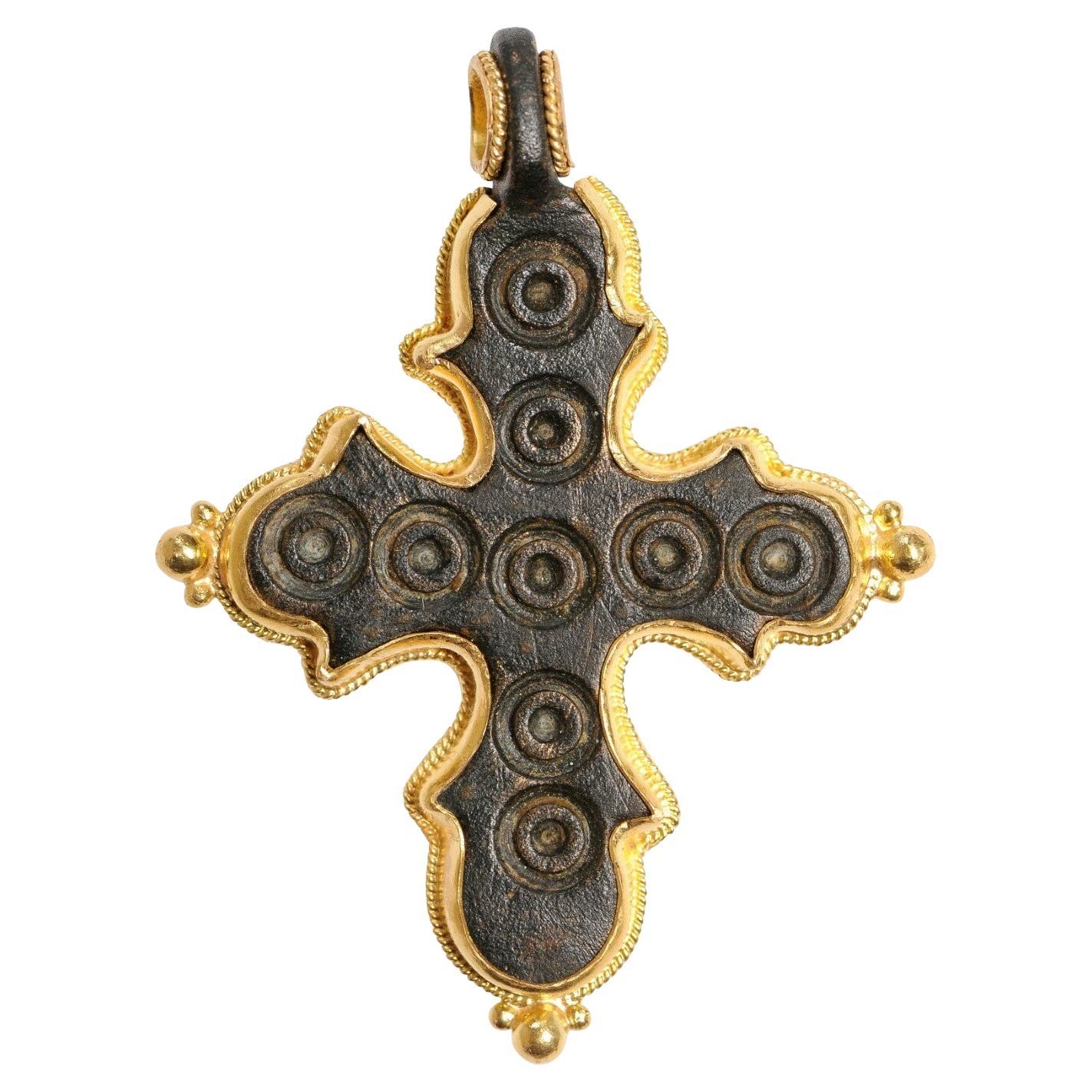 A Curvy Byzantine Bronze Cross w/ elaborate Gold Trim