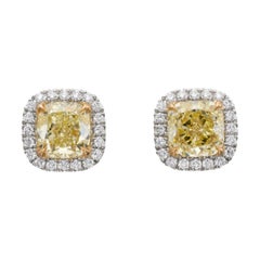 A Cushion Shaped 1.31 ct Fancy Yellow Internally Flawless and VS2 Diamond Earrin