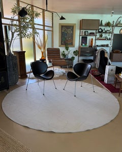 A custom hand-woven round wool area rug by Paola Lenti, Italy 21st century