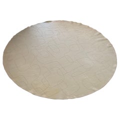 A custom hand-woven round wool area rug by Paola Lenti, Italy 21st century
