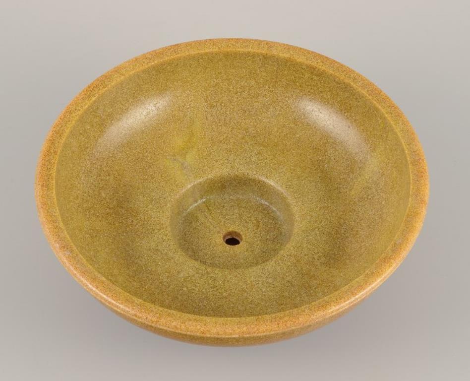 Glazed A. D. Copier, Dutch ceramicist. Ceramic flower pot. Glaze in yellow-green tones.