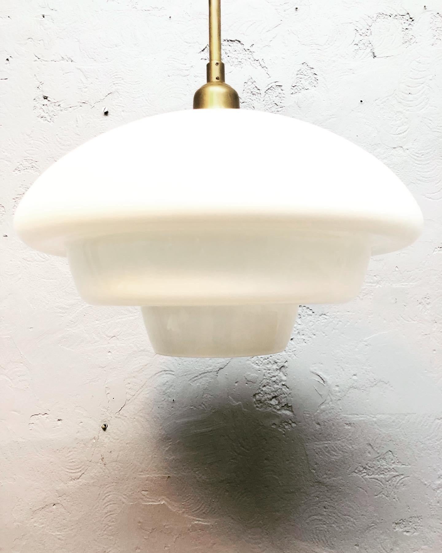 An Art Deco opaline glass pendant from the 1930s by Fyens Glasværk of Denmark. 
Great quality and craftsmanship from the blowing of the opaline glass to the brass work on the lamp. 
The opaline glass is in great condition with no cracks or chips.