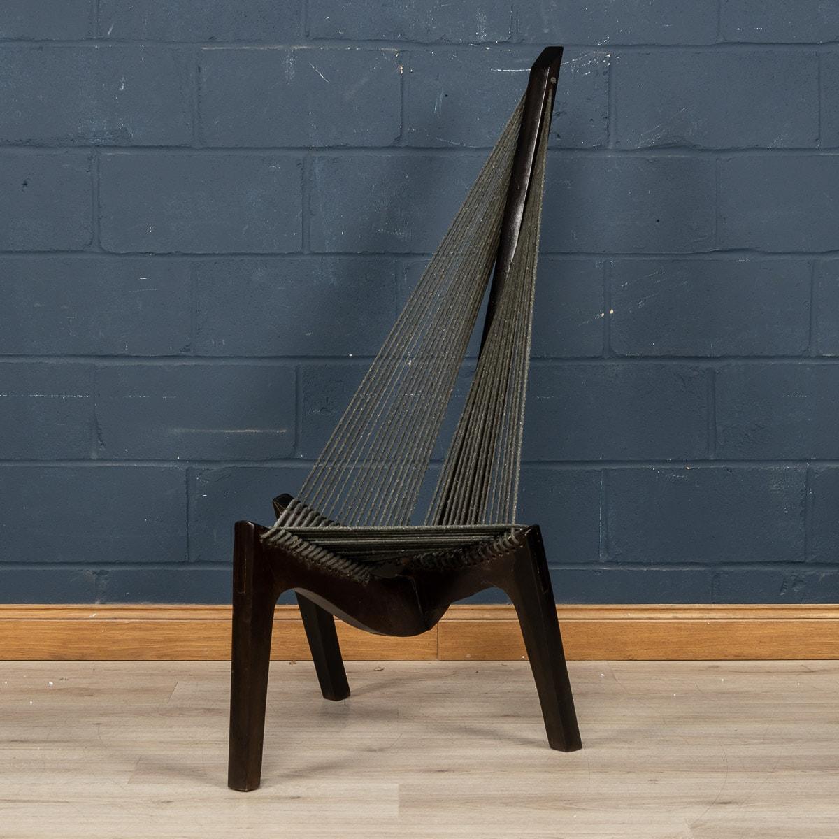 A nice vintage Harp chair designed by and attributable to Jorgen Hovelskov and manufactured by Christensen & Larsen, Mobelhadvaerk, Copenhagen in 1960s. Its unique form was inspired by a Viking ship bow section. The expertly crafted frame, in solid