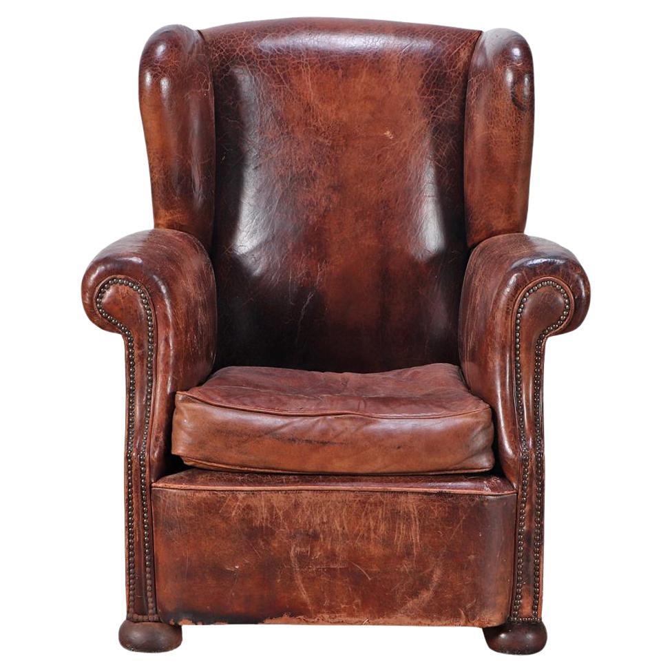 A Danish Leather Wing Chair, C. 1950. For Sale