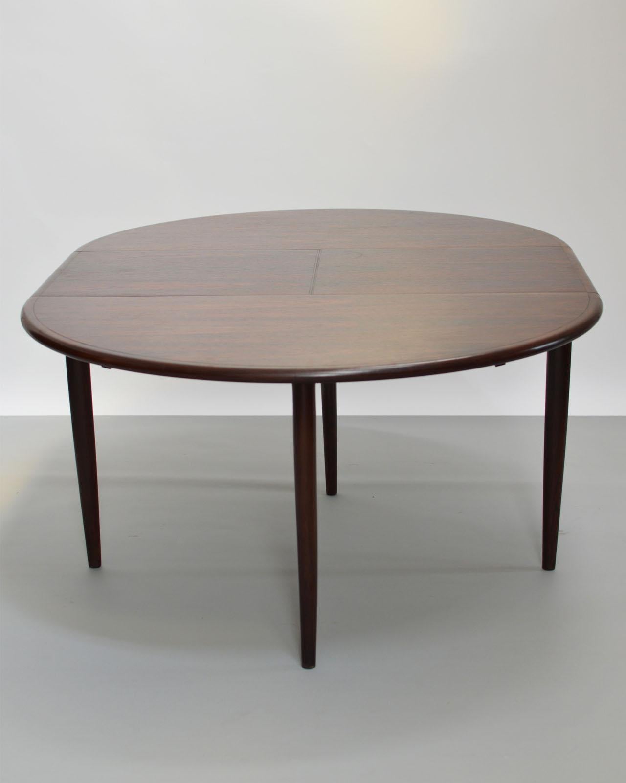 A Danish mid-century design extendable dining table, manufactured by Niels Otto Møller and for J.L. Møllers Møbelfabrik, c.1960.

The dining table has been designed in rosewood.