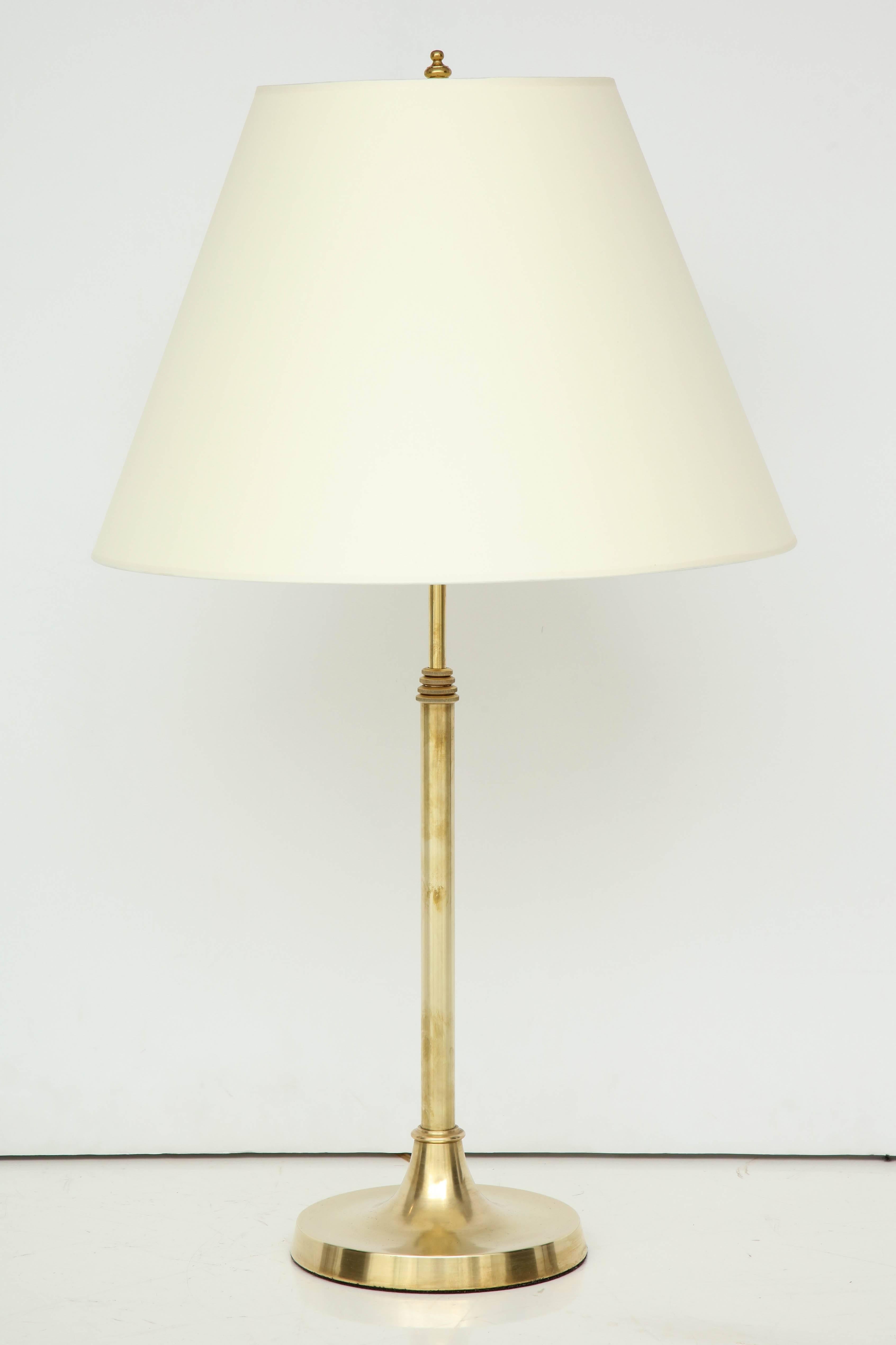 A Danish brass telescopic lamp with a sectional tapered stem and circular base, circa 1940s. Probably designed by Aage Petersen (Danish, 1902–1982)
Good brass finish, re-wired for the US.