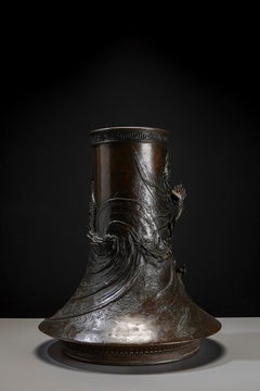 A dark-patinated bronze vase with a relief Ryu dragon