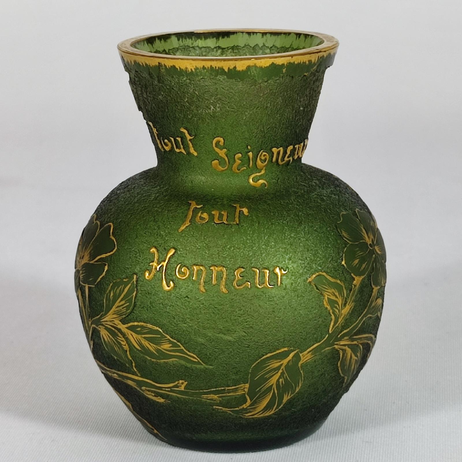 A miniature french gilt and enameled green cameo glass vase, 
signed in gilt 