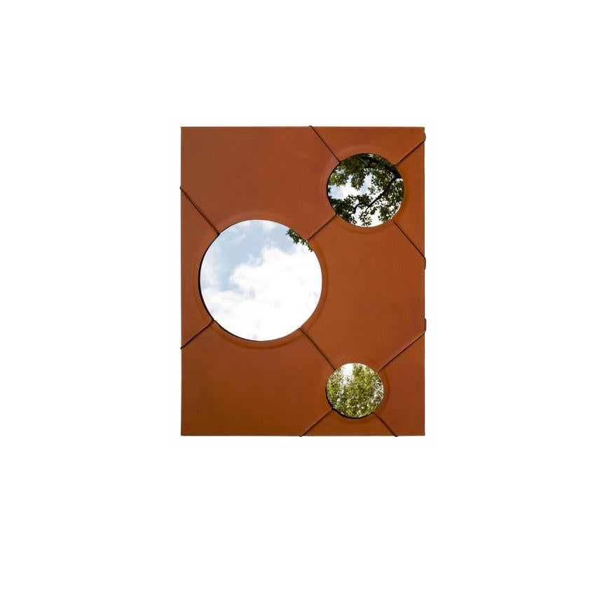 A Day In The Life Wall Mirror with Faux Leather Frame by Oscar Maschera
Dimensions: W 73,5 x H 93 cm.
Materials: Mirror and vegetable leather.

“A day in the life” is a mirror from the Miroirs et Tapis collection. The object is shaped around three