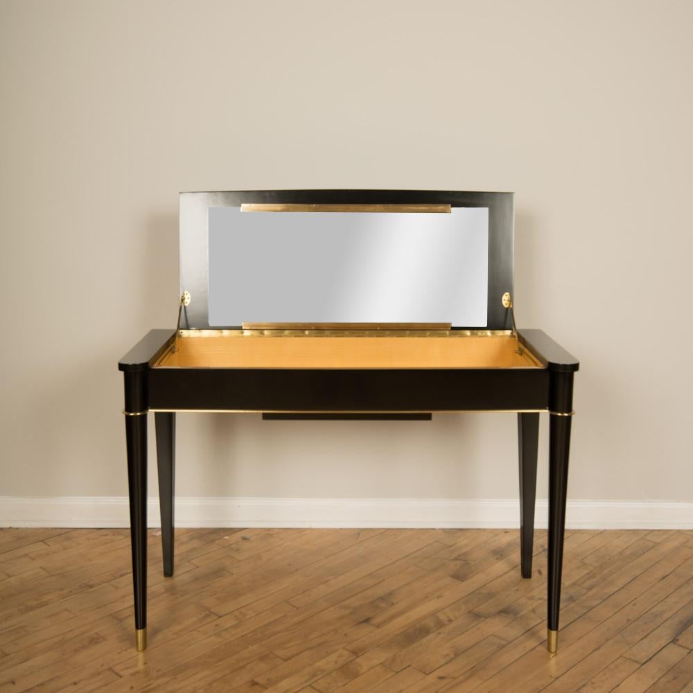 A De Coene Frères designed Art Deco vanity in ebonized mahogany and pearl wood with brass details, circa 1930.